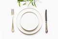 Minimal modern table setting on white. View from above. View from above