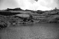 Minimal monochromatic view of lake and rock mountains