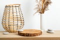 Minimal natural wood home decor with pine wood disc pedestal with bark. Royalty Free Stock Photo