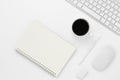 Minimal Office desk table top view with notebook blank pages, Keyboard computer, mouse, coffee cup on a white table with copy Royalty Free Stock Photo