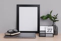 Minimal Office with mini calendar, portrait and laptop in gray background mockup