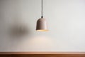 minimal pendant light fixture against a neutral wall Royalty Free Stock Photo