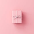 Minimal pink gift box with white rope ribbon bow on pink pastel color background with shadow minimal concept Royalty Free Stock Photo