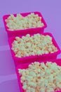 Minimal popcorn set in plastic box on purple background. Isometry trendy vertical design. Fast food, Home cinema concept