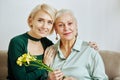Minimal Portrait of Woman with Senior Mother Royalty Free Stock Photo
