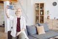 Contemporary Bald Woman Taking Selfie Photo at Home