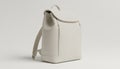 A minimal product scene featuring a pale neutral light backpack with soft warm white tones and subtle woven texture Royalty Free Stock Photo