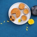 Minimal simplicity layout moon cakes on blue background for Mid-Autumn Festival