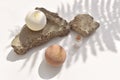 Minimal spa still life with bath bombs and aroma salt on rock stone stands. Zen eco concept Royalty Free Stock Photo