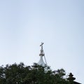 Minimal view over the top of a church at the end of the day, white cross in blue sky, Madeira, Portugal Royalty Free Stock Photo