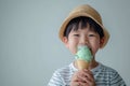 Minimal Style High Stock Image Of Boy Enjoying Mint Chocolate Ice Cream On White Background