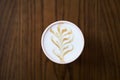 Coffee cup with latte art swirls in foam Royalty Free Stock Photo
