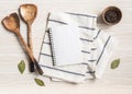 Minimal white kitchen background with blank notebook for text, cotton napkin, various spices and wood appliances Royalty Free Stock Photo