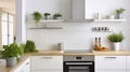 A Minimal White Kitchen Interior Brightened by a Silver Cooker Hood and Wooden Details Royalty Free Stock Photo