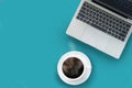 Minimal work space - Creative flat lay photo of workspace desk. Top view office desk with laptop, notebooks and coffee cup on blue Royalty Free Stock Photo