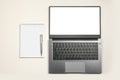 Minimal workplace mockup with laptop and blank notepad on white isolated background. Top view. Flat lay laptop with blank screen Royalty Free Stock Photo
