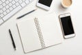 Minimal workspace flat lay with phone and notebook Royalty Free Stock Photo