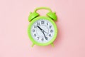 Minimalism green Alarm clock on a pink background one