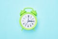 Minimalism green room alarm clock on a blue background copy