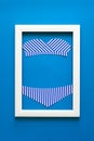 Minimalism. Masterpiece in wooden frame. Swimsuit. Top view. Flat lay. Summer travel concept. Origami