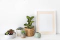 Minimalism Nordic closet shelves neatly folded bed linens and potted plants frame border copy space