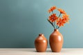 minimalism photo two modern terracotta vases with orange flowers on a table with copy space on blue background