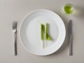 Minimalism with a twist: fresh celery, cutlery and a stylish look from above
