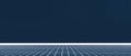 Minimalist abstract composition with grid pattern floor and solid dark blue background creating futuristic perspective and Royalty Free Stock Photo