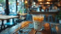cafe chill vibes, minimalist aesthetic empty cafe table featuring an iced latte, emphasizing the refreshing coolness of Royalty Free Stock Photo