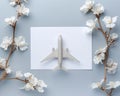 Minimalist Aesthetic Flat Lay with Airplane Model and White Flowers on Light Blue Background Travel Concept Imagery for Dreamy Royalty Free Stock Photo