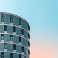 Minimalist apartment building in Hamburg against beautiful orange and teal blue sky Royalty Free Stock Photo