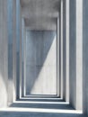 Minimalist architectural corridor with tall concrete pillars featuring dramatic natural light and sharp shadows creating geometric Royalty Free Stock Photo