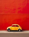 Minimalist background featuring a small car parked on a vibrant city street against a colorful wall.