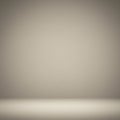 A minimalist background featuring a smooth gradient from beige to light brown. The Royalty Free Stock Photo