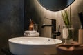 Minimalist bathroom close up with sleek matte black faucet