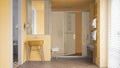 Minimalist bathroom in yellow tones with sink, large shower with glass cabin, heated tower rail with towels, herringbone parquet,