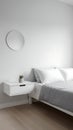 Minimalist Bedroom Interior with White Bed and Nightstand Royalty Free Stock Photo