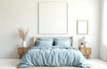Minimalist bedroom mockup with light blue bedding. Features two blank picture frames above the bed. Coastal boho decor includes Royalty Free Stock Photo