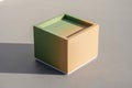 Minimalist beige cube with a subtle shadow on a neutral gray surface Royalty Free Stock Photo