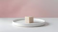Minimalist Beige Cube on White Round Tray with Pink Background Royalty Free Stock Photo