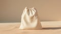 Minimalist Beige Drawstring Pouch on Neutral Background