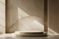 Minimalist Beige Interior with Sunlight Casting Shadows on Circular Pedestal Royalty Free Stock Photo