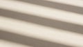 Minimalist Beige Background with Diagonal Shadow Stripes Cast by Blinds Creating a Subtle Textured Surface with Soft Light and Royalty Free Stock Photo