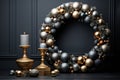 A minimalist black room with a focus on a stunning gold Christmas wreath hanging on the wall, adding a touch of festive elegance