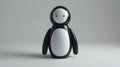 Minimalist Black and White Penguin Figurine on Plain Background
