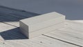 Minimalist Blank White Rectangular Box on White Wooden Surface Royalty Free Stock Photo