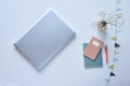 Minimalist blogger desktop laptop and pastel accessoires with flowers