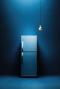 Minimalist blue kitchen with modern refrigerator and pendant light Royalty Free Stock Photo