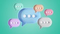 Minimalist blue red orange purple speech bubbles talk icons floating over green background. Modern conversation or social media