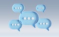 Minimalist blue and white speech bubbles talk icons floating over grey background. Modern conversation or social media messages Royalty Free Stock Photo